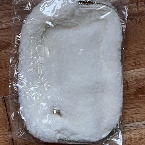 Sherpa belt bag with rose gold/champagne colored belt. New in bag retails $58.